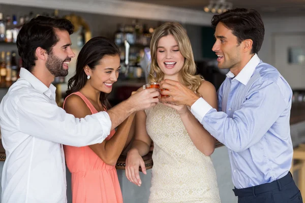 Friends toasting  glasses of tequila shot — Stock Photo, Image