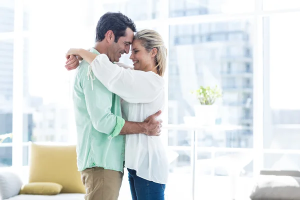 Couple hugging at home — Stock Photo, Image