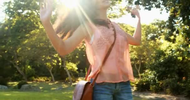 Young woman enjoying in park — Stock Video