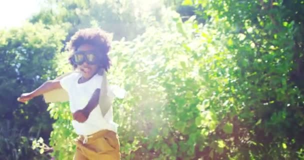 Little boy running in costume of aviator — Stock Video