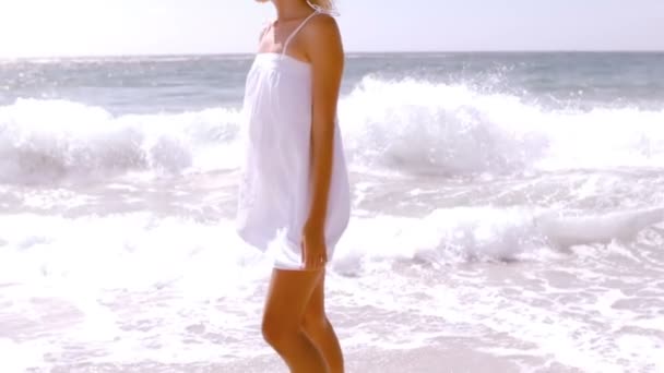 Smiling woman touching the water — Stock Video