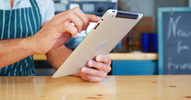 Young man using digital tablet — Stock Video