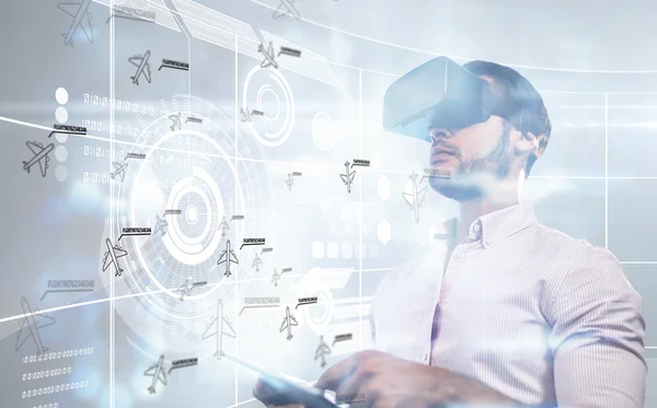 Composite image of man using an oculus and a tablet — Stock Photo, Image