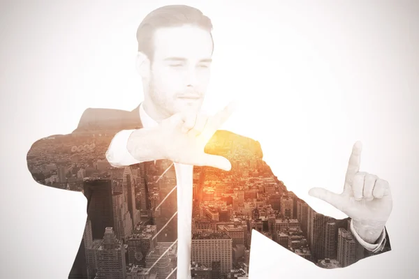 Happy businessman pointing with fingers — Stock Photo, Image