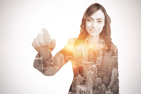 Portrait of businesswoman touching invisible screen — Stock Photo, Image