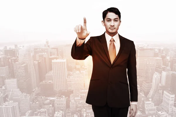 Stern asian businessman pointing — Stock Photo, Image