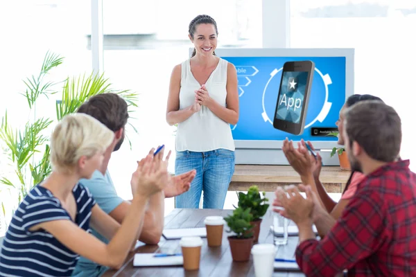 Colleagues clapping hands in a meeting — Stock Photo, Image