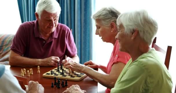 Five senior people playing chess — Stock Video