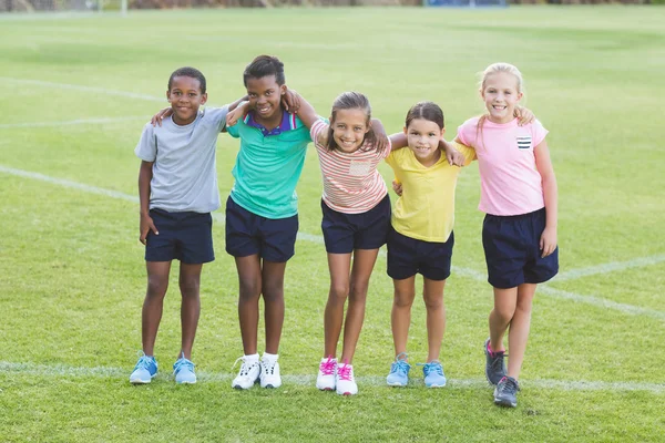 School kids standing with arms around — Stock Photo, Image