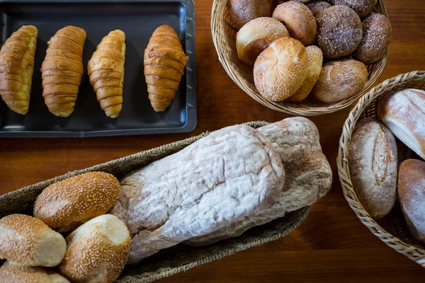 Various breads on display counter — Stock Photo, Image