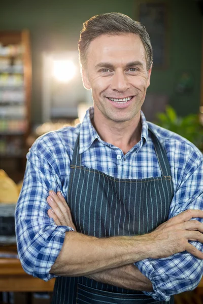 Male staff standing with his hands crossed — Stock Photo, Image
