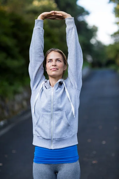 Woman exercising on the open road — Stock Photo, Image