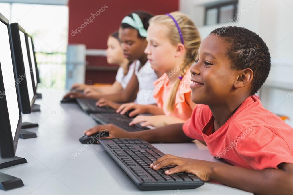 School kids using computer in classroom Stock Photo by ©Wavebreakmedia ...