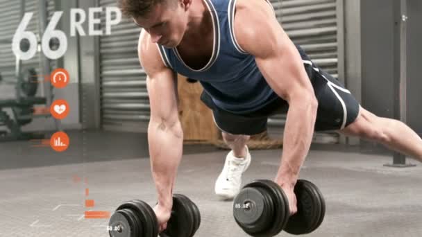 Athlete performing push ups with dumbbell — Stock Video