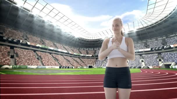 Female athlete clapping hands in stadium — Stock Video