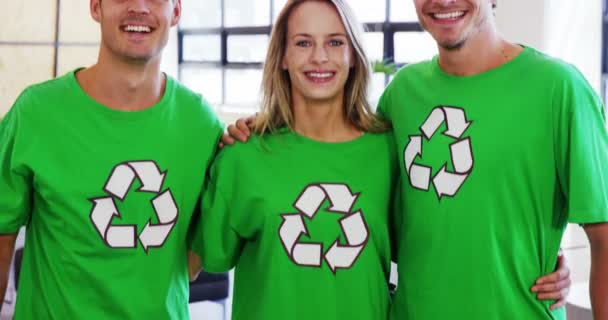 Volunteers wearing green ecologic t-shirts — Stock Video