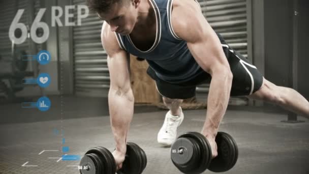 Athlete performing push ups with dumbbell — Stock Video