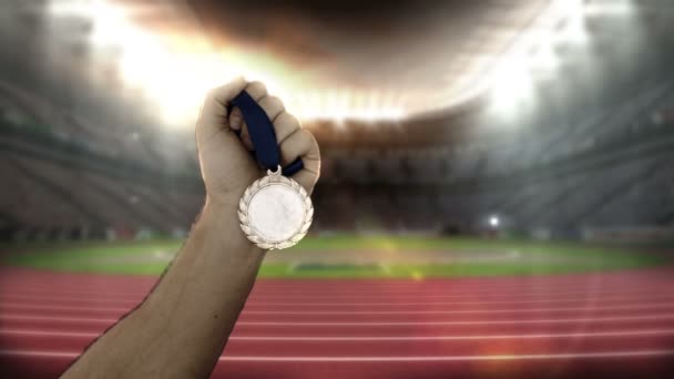 Hand of athlete showing gold medals — Stock Video