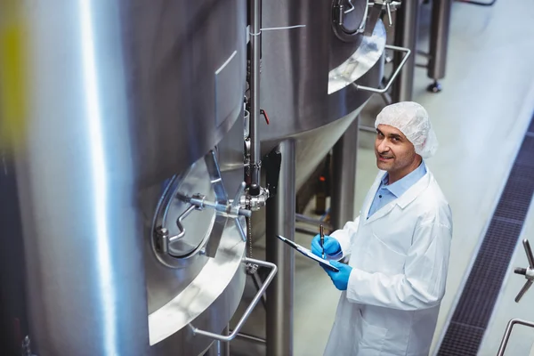 Portrait of manufacturer standing at brewery — Stock Photo, Image