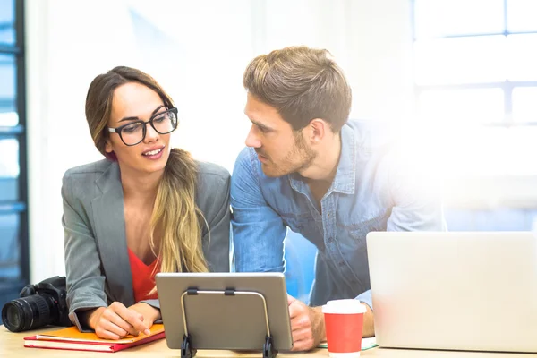 Business people discussing over tablet — Stock Photo, Image