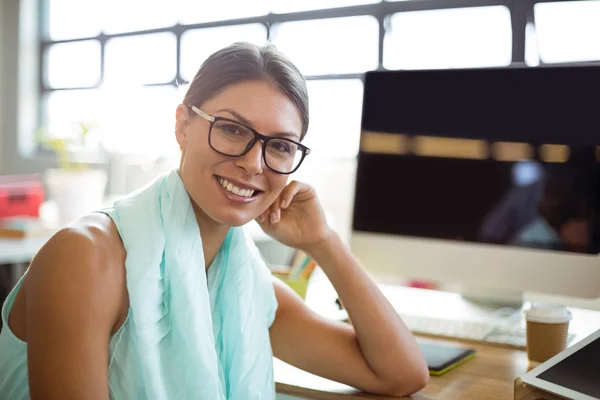 Business executive sitting in office — Stock Photo, Image