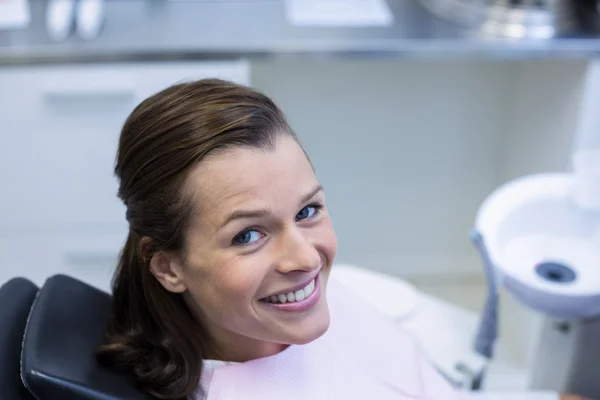 Female patient sitting on dentist chair — Stock Photo, Image