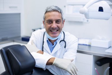 Portrait of a smiling dentist clipart