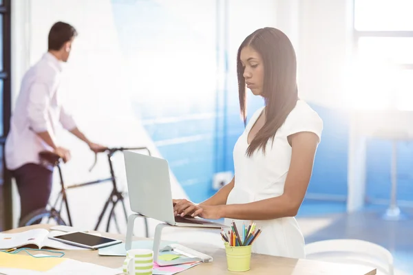 Business executive using laptop — Stock Photo, Image