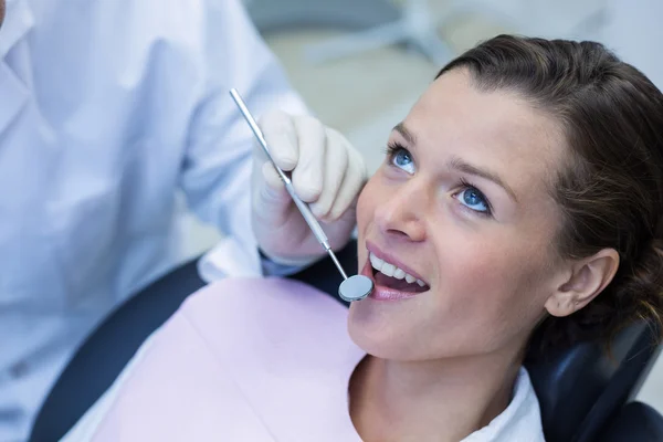 Patient teeth being examined with angle mirror — Stock Photo, Image