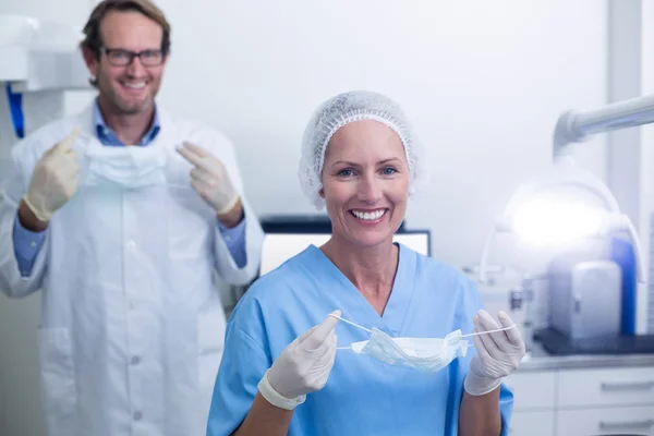 Portrait of dentist and dental assistant wearing surgical mask — Stock Photo, Image