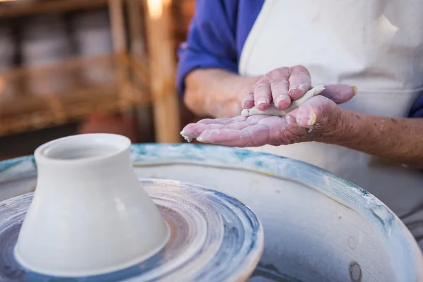 Mid section of potter making pot — Stock Photo, Image