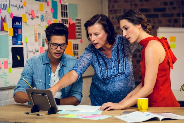 Business people discussing over digital tablet — Stock Photo, Image