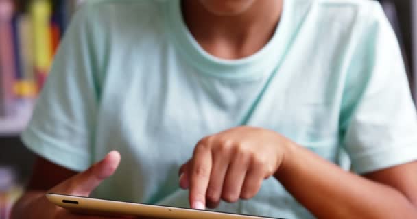 Schoolboy using digital tablet in classroom — Stock Video