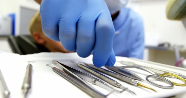 Dentist examining a young patient — Stock Video