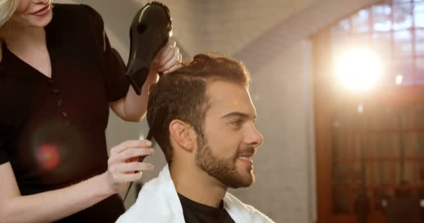 Man getting his hair dried — Stock Video