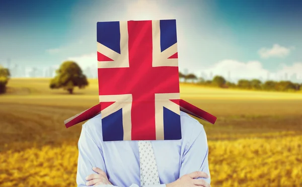 Anonieme zakenman tegen uk nationale vlag — Stockfoto
