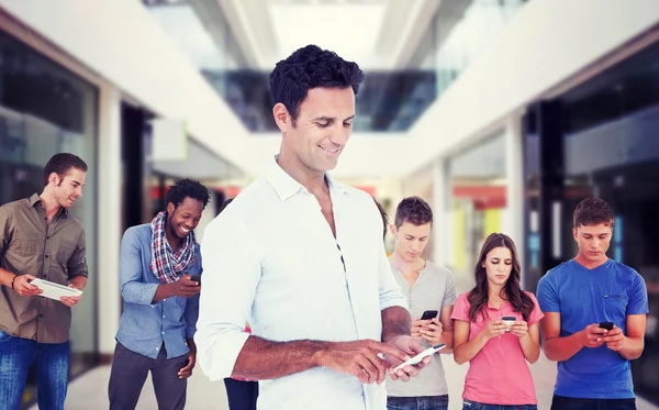 Handsome man using smartphone — Stock Photo, Image