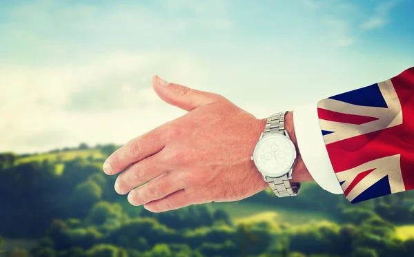 Businessman in suit clenching fists — Stock Photo, Image