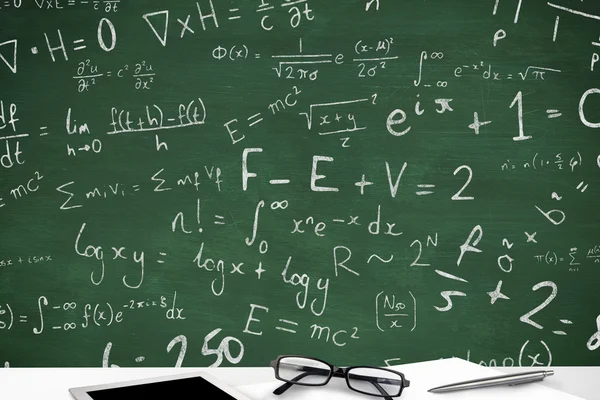 Maths signs against green chalkboard — Stock Photo, Image