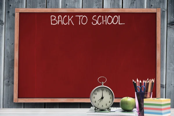 Back to school message against blackboard — Stock Photo, Image