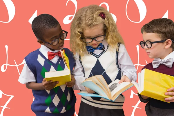 School kids looking at book — Stock Photo, Image