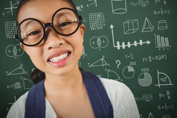 Chica sonriendo contra los iconos de matemáticas — Foto de Stock