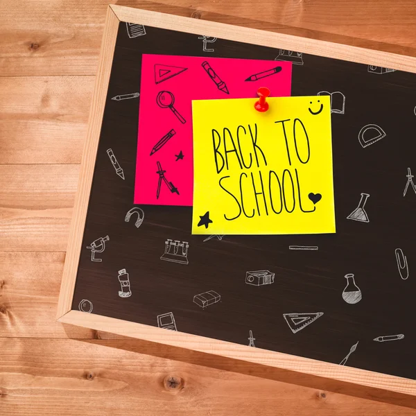 Small blackboard on wooden floor — Stock Photo, Image