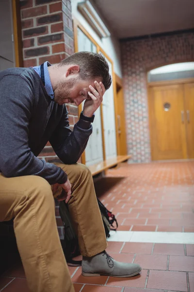 Stressed mature student in locker room — Stock Photo, Image