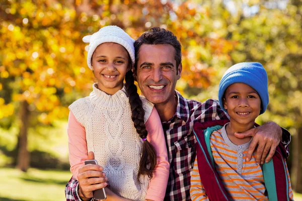 Father with children at park — Stock Photo, Image