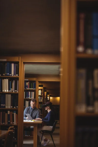 Mature students working in college library — Stock Photo, Image