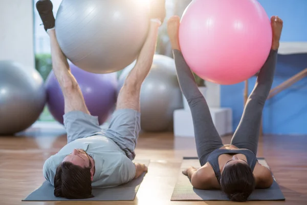 Man and woman holding exercise ball — Stock Image Man and woman holding exercise ball Stock Photo