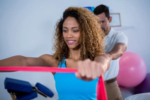 Physiotherapist giving shoulder massage to patient — Stock Photo, Image