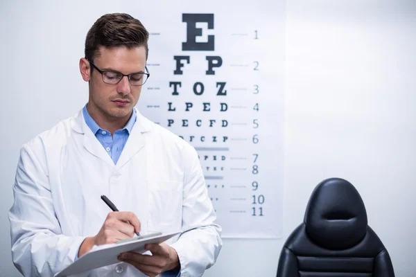 Escritura optometrista en portapapeles — Foto de Stock