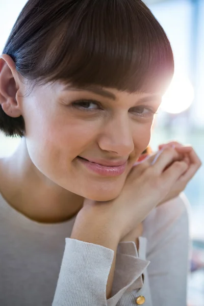 Close-up of smiling woman in cafeteria — Stock Photo, Image